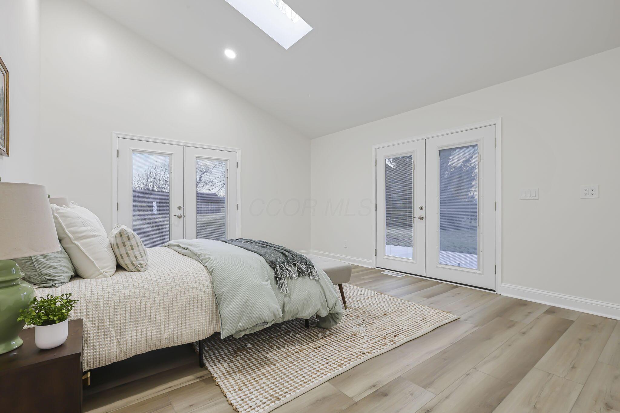 6965 Gay Road Grove City, OH 43123 - Photo 27 of 67 Primary ensuite with vaulted ceilings and doors to both patio areas.