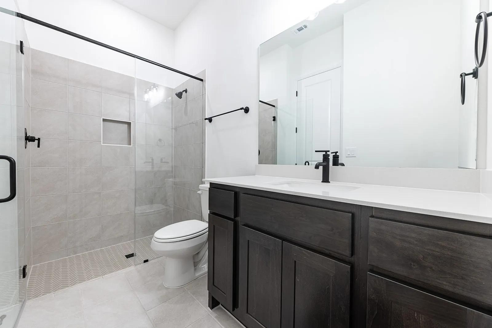 308 Buckaroo Drive Georgetown, TX 78633 - Photo 20 of 31 a bathroom with a sink toilet and shower