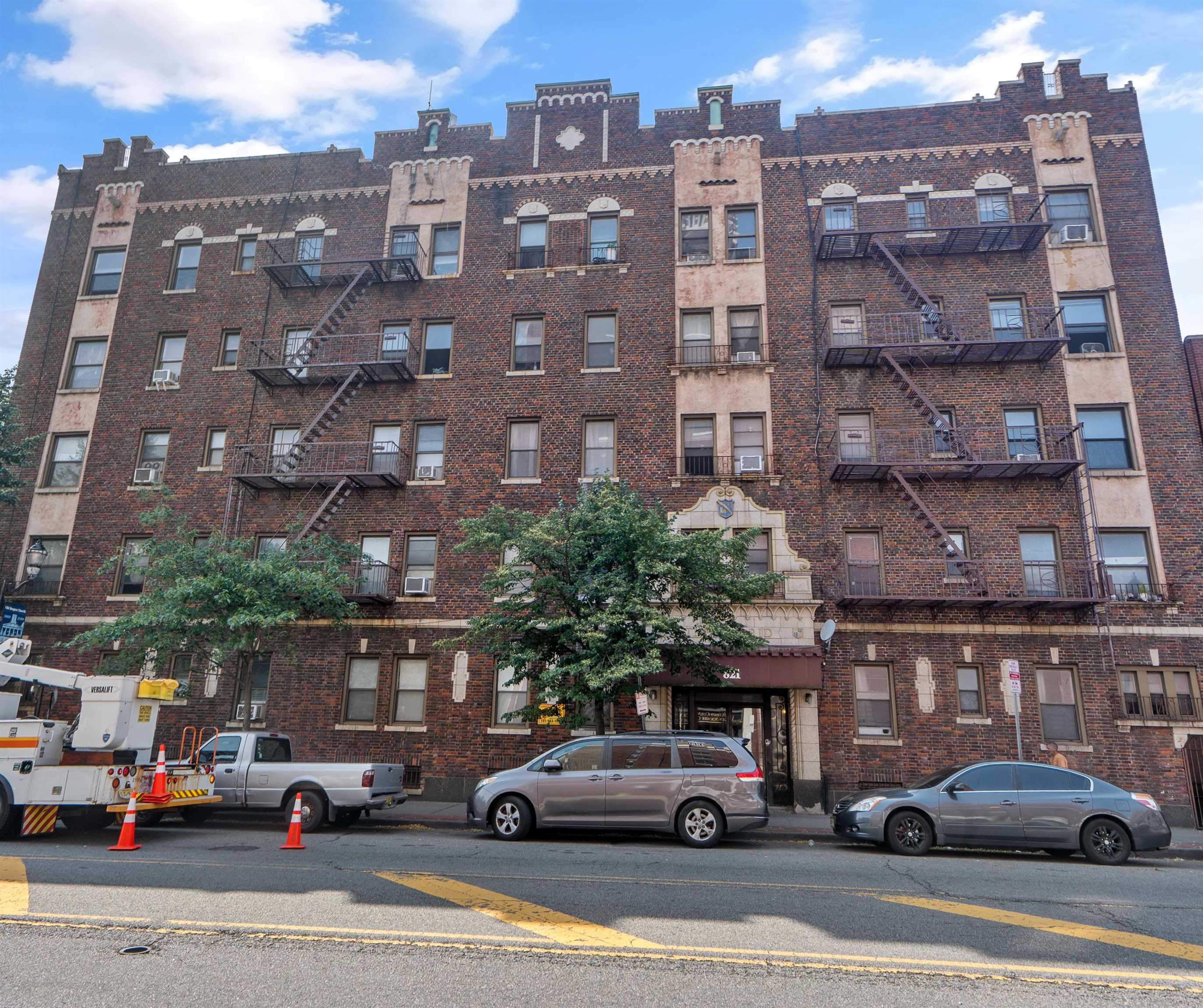 821 Bergen Avenue, Unit B5 Jersey City, NJ 07306 - Photo 1 of 13 a view of a cars parked in front of a building