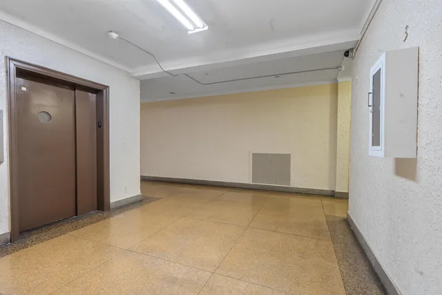 a front view of a building with glass windows