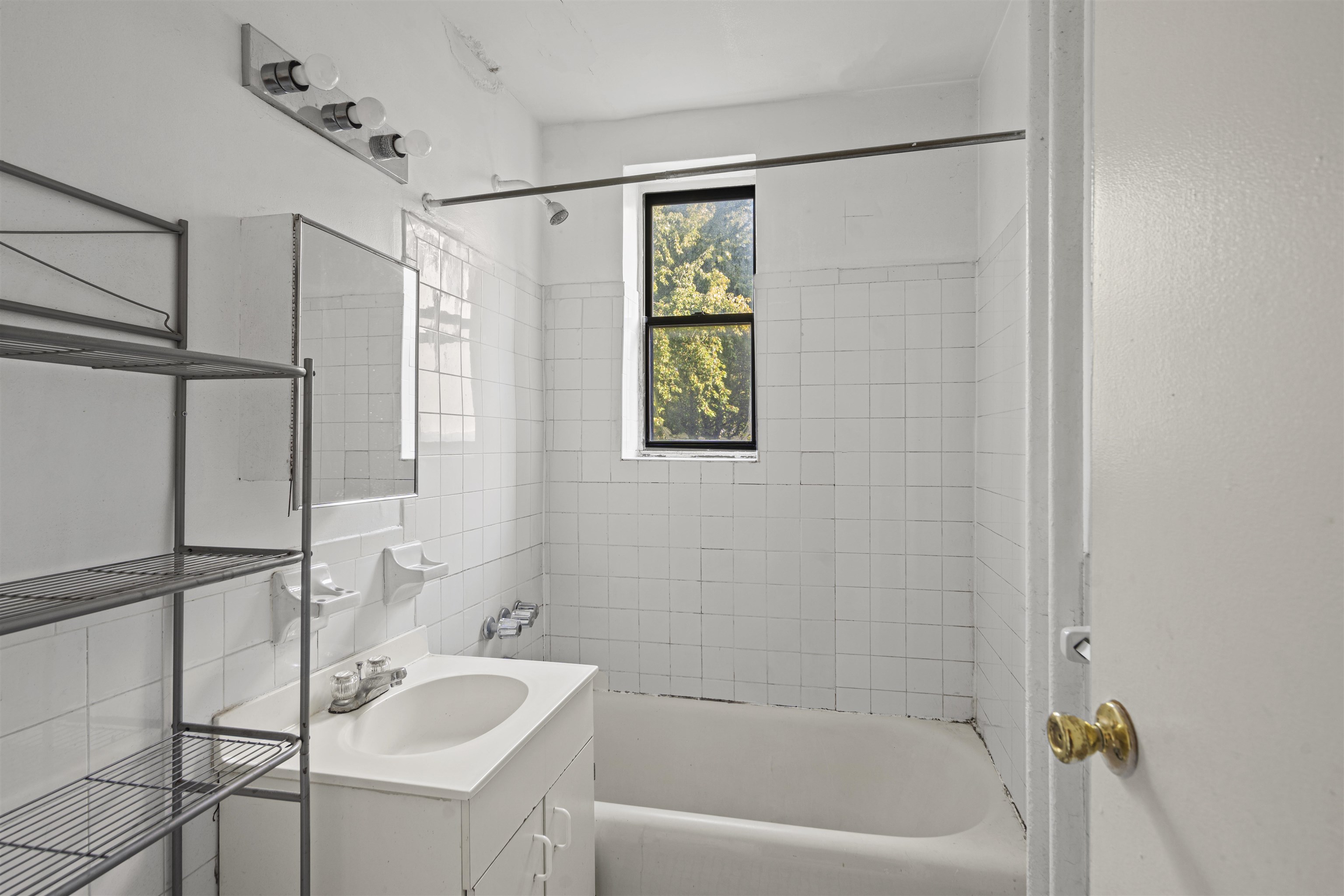 821 Bergen Avenue, Unit B5 Jersey City, NJ 07306 - Photo 9 of 13 a bath room with a sink and a bath tub