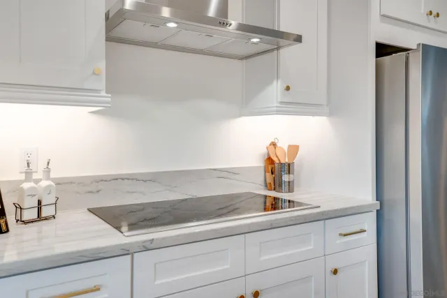 a kitchen with a sink and cabinets