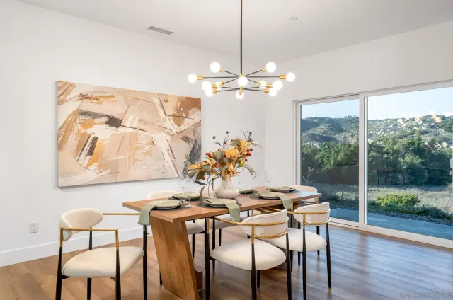 a view of a dining room with furniture window and outside view