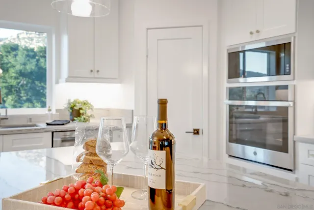 a living room with furniture a window and kitchen view