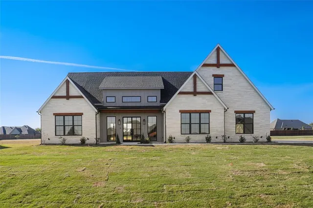 a view of a house with swimming pool and porch