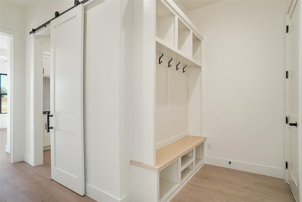207 Stuart Street Paradise, TX 76073 - Photo 12 of 30 a room with white cabinets and white walls