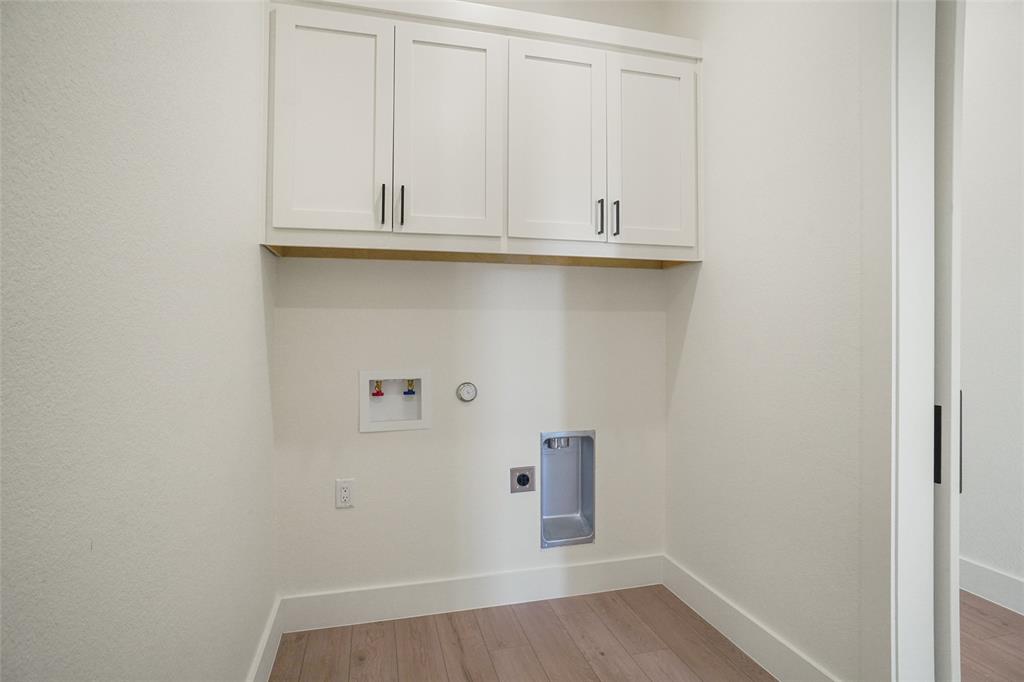 207 Stuart Street Paradise, TX 76073 - Photo 14 of 30 a view of cabinets