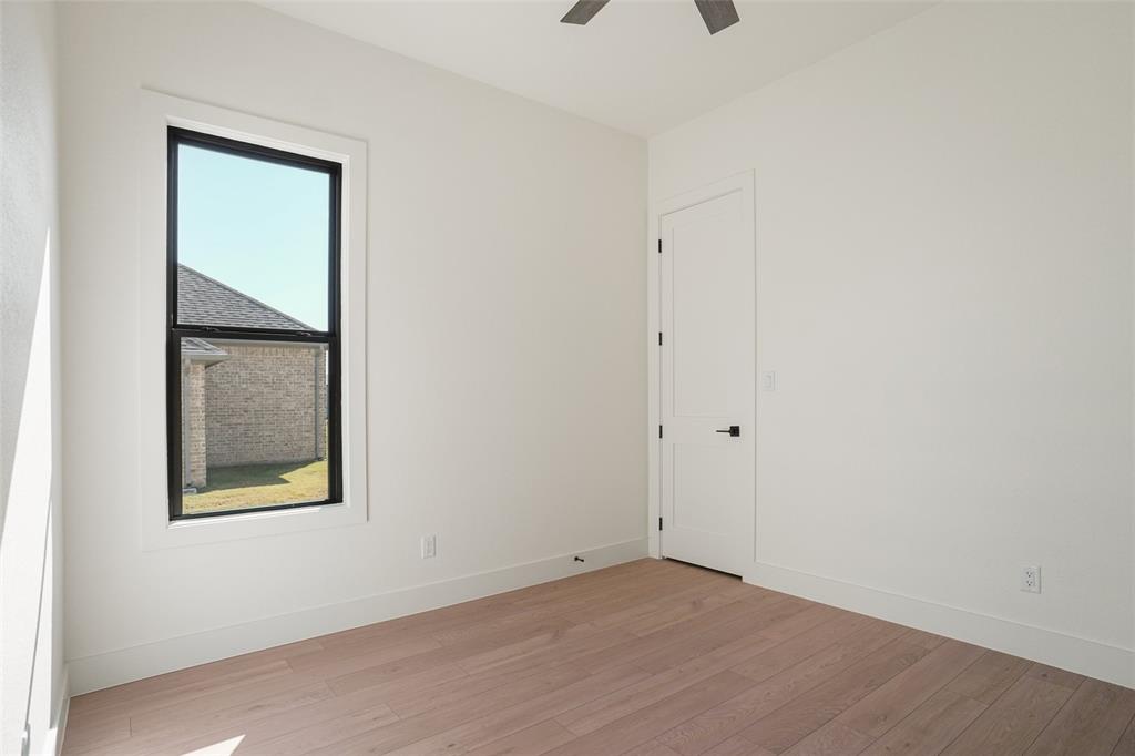 207 Stuart Street Paradise, TX 76073 - Photo 21 of 30 an empty room with a window