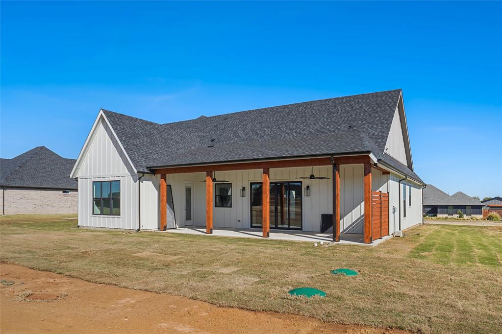 207 Stuart Street Paradise, TX 76073 - Photo 28 of 30 a view of a house with wooden floor and a basket ball court