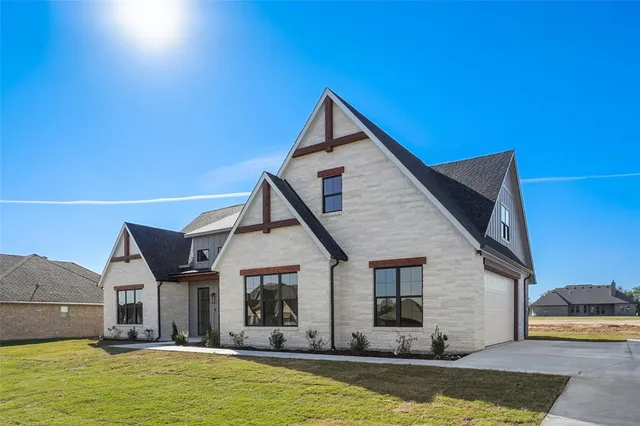 a view of a house with swimming pool and porch