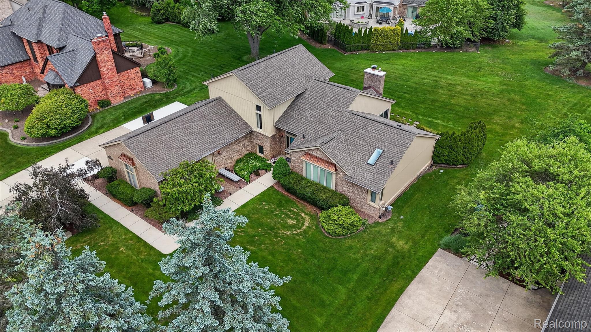 1236 Chaffer Drive Rochester, MI 48306 - Photo 75 of 76 Brick and stucco exterior property with a dark shingle roof
