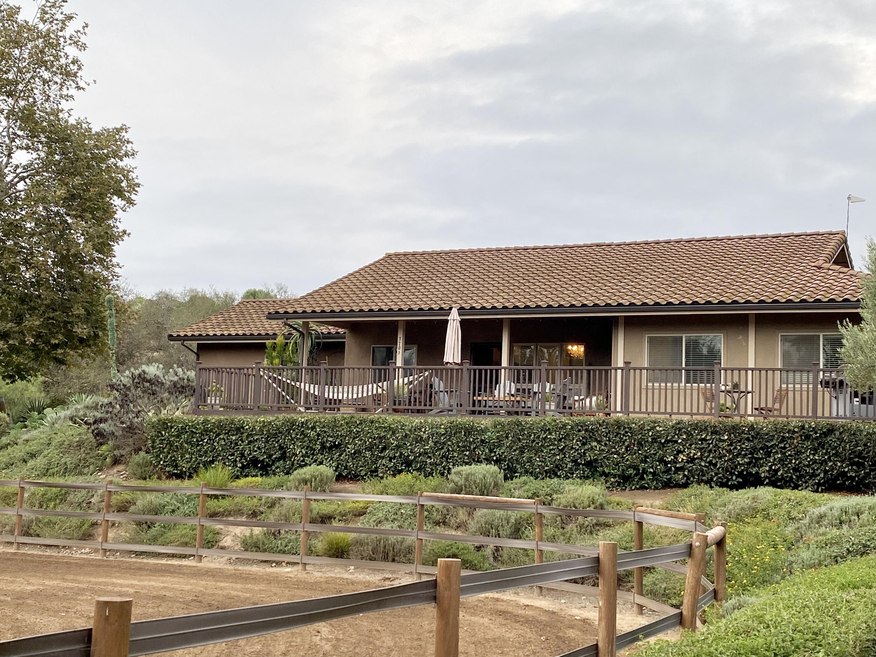3705 La Canada Road Fallbrook, CA 92028 - Photo 19 of 68 a front view of a house with a yard