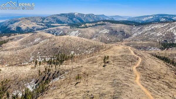 a view of mountains and valleys