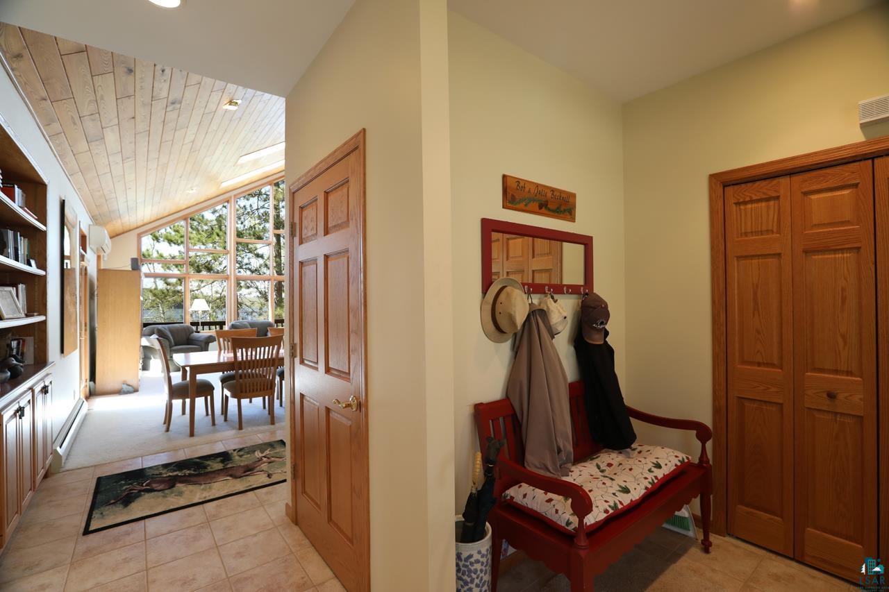 1880 Everett Bay Road Tower, MN 55790 - Photo 16 of 50 Foyer entrance featuring light tile patterned floors and lofted ceiling