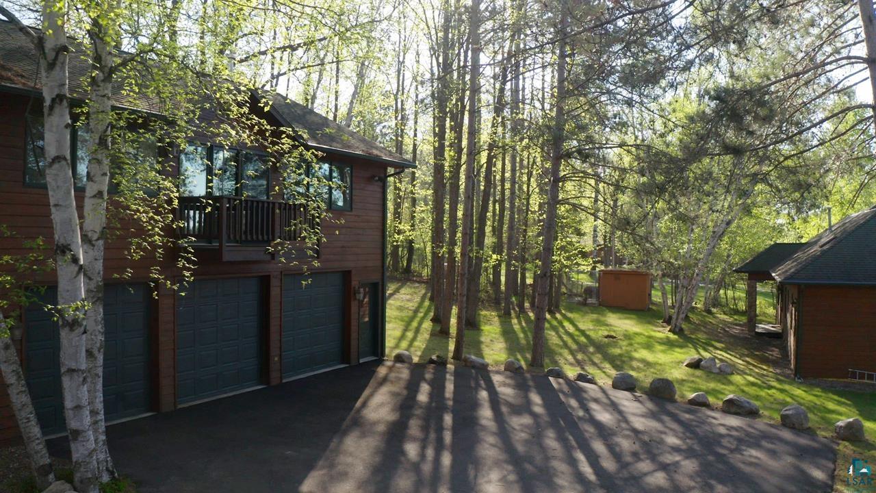 1880 Everett Bay Road Tower, MN 55790 - Photo 28 of 50 View of property exterior featuring driveway and an attached garage