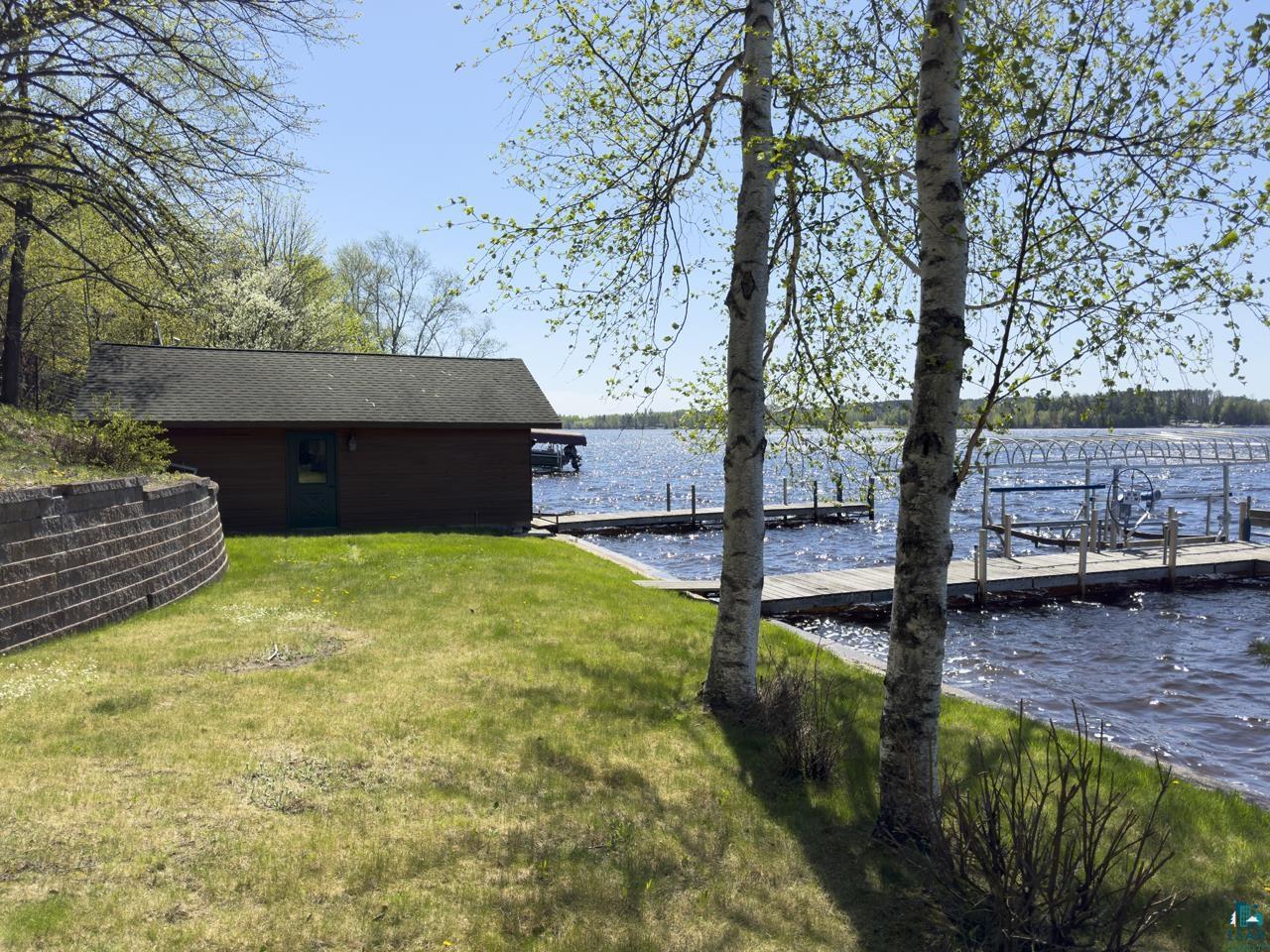 1880 Everett Bay Road Tower, MN 55790 - Photo 44 of 50 Dock with a water view and a lawn