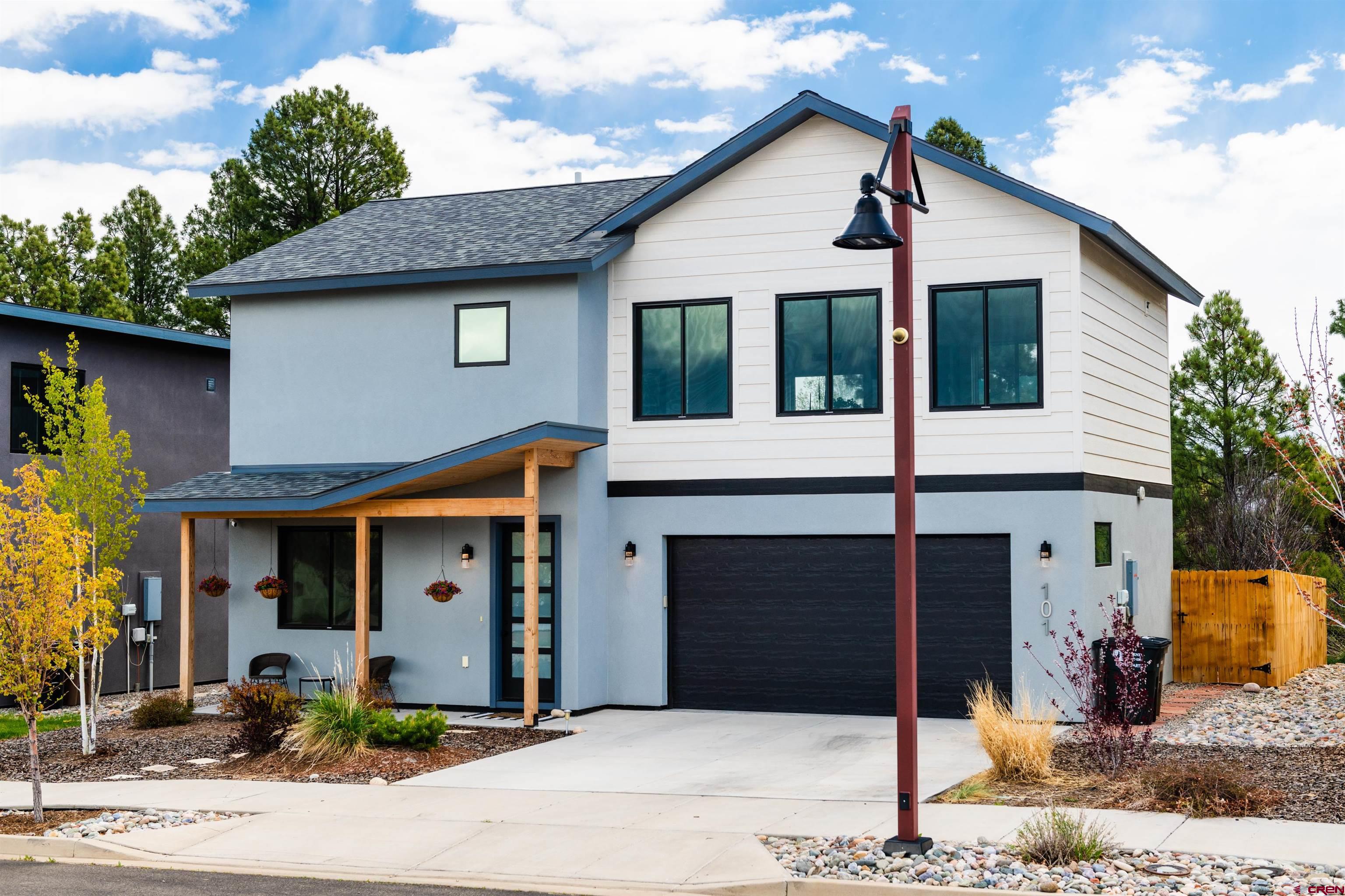 101 Elevation Drive Durango, CO 81303 - Photo 1 of 25 a front view of a house with garden