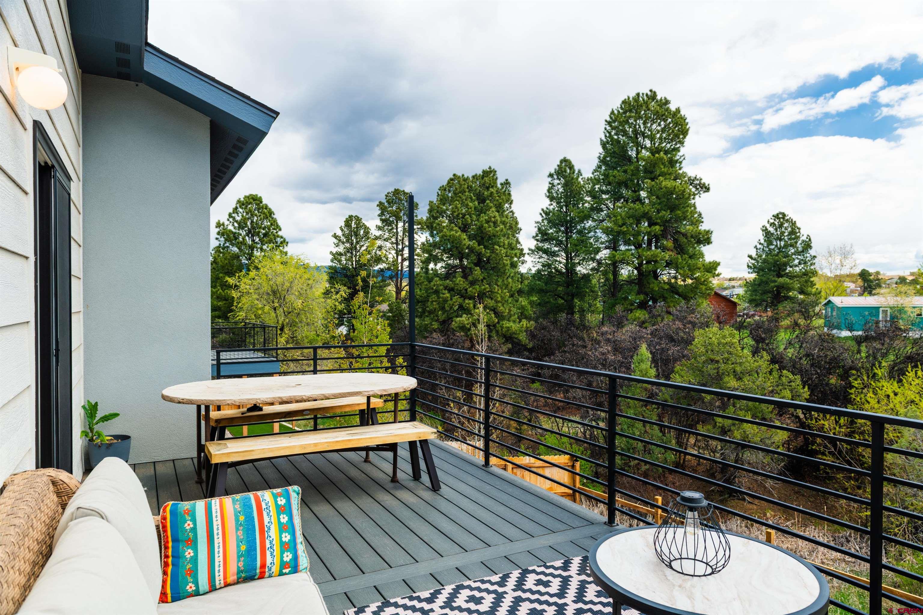 101 Elevation Drive Durango, CO 81303 - Photo 11 of 25 a view of a chairs and tables in the balcony