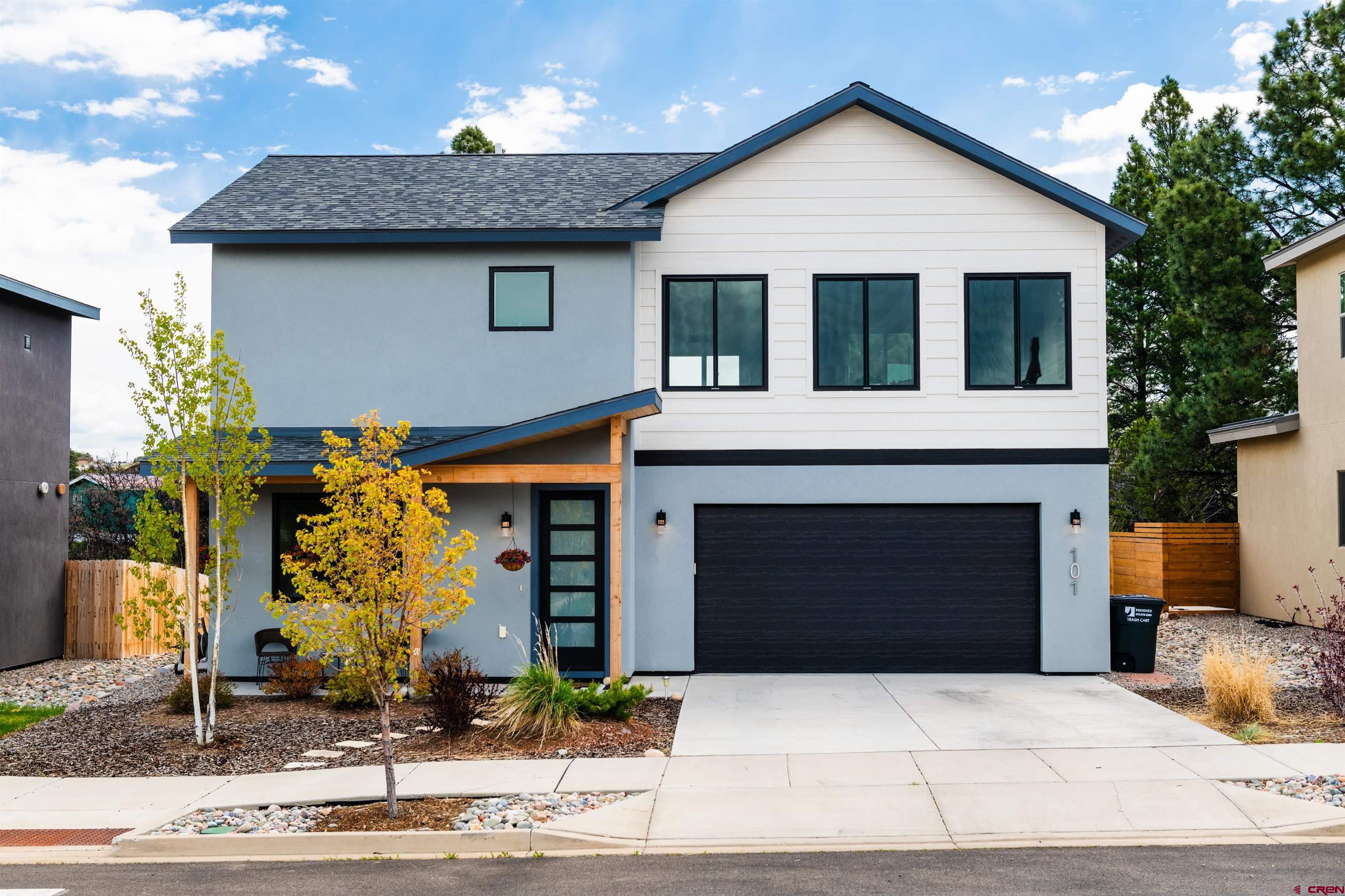 101 Elevation Drive Durango, CO 81303 - Photo 2 of 25 a front view of a house with yard