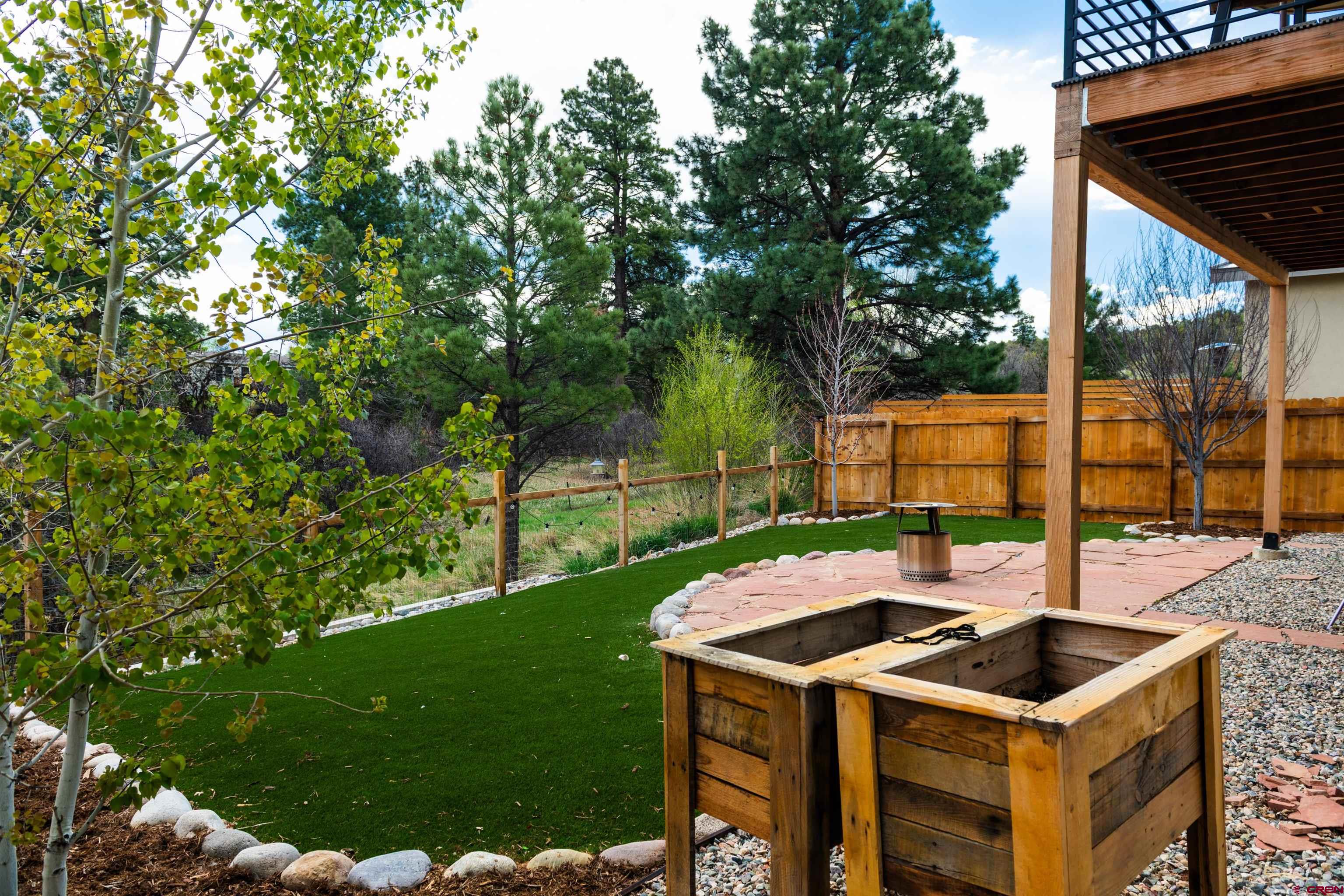 101 Elevation Drive Durango, CO 81303 - Photo 23 of 25 a table and chairs with the garden in the background