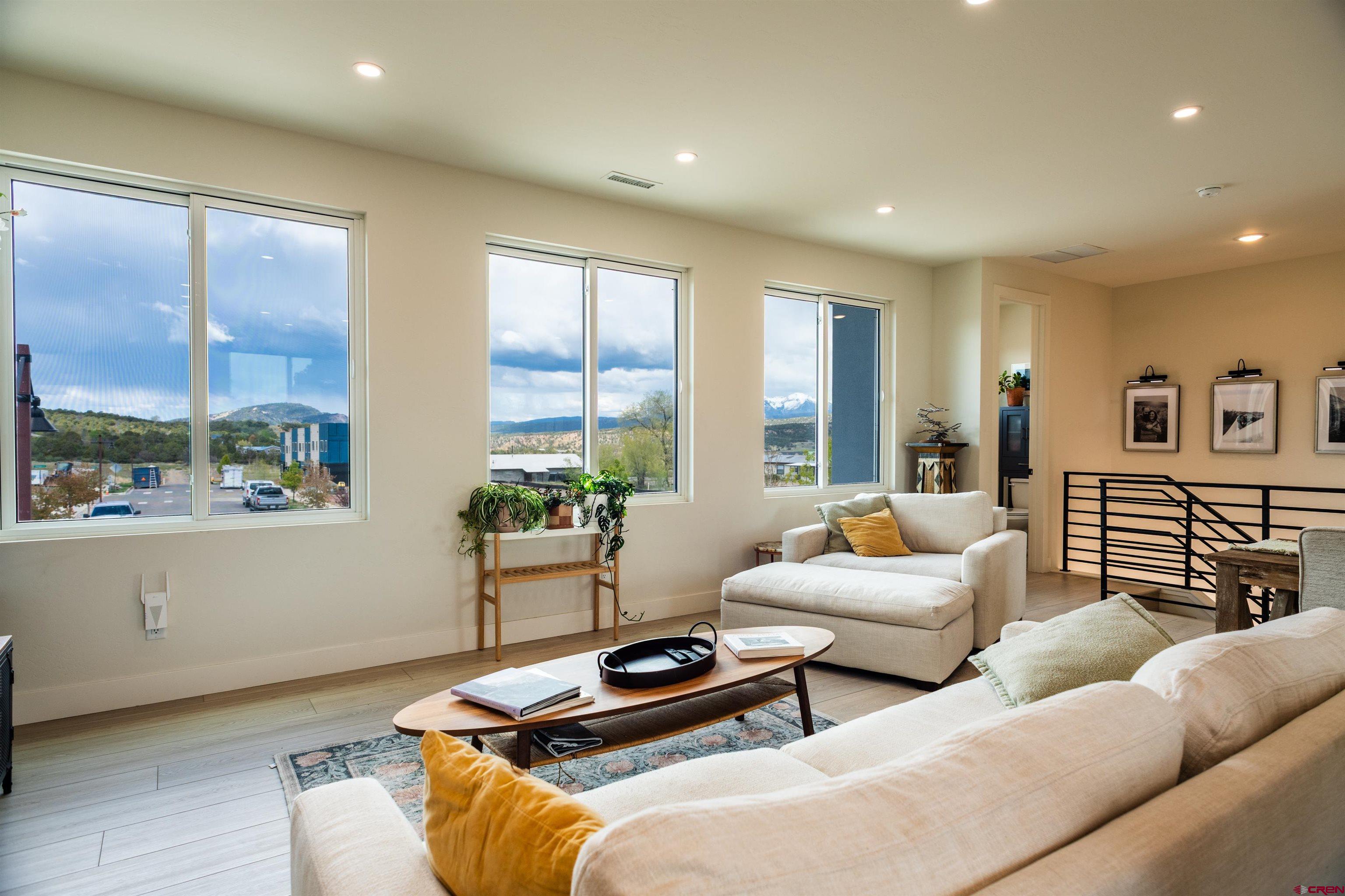 101 Elevation Drive Durango, CO 81303 - Photo 4 of 25 a bedroom with furniture and a large window