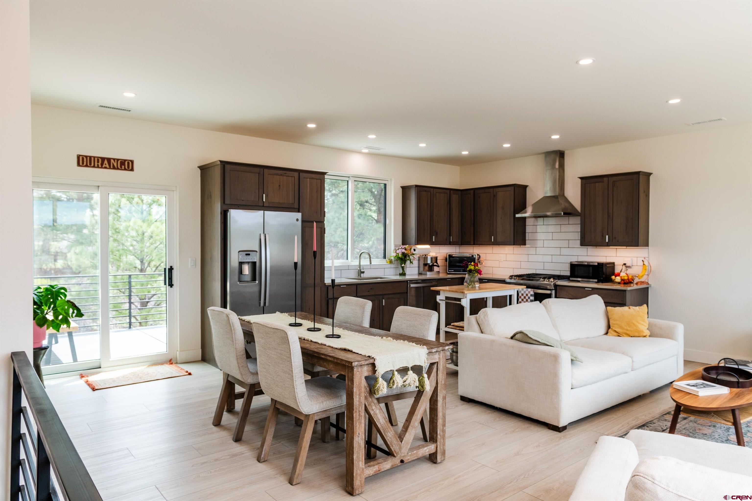 101 Elevation Drive Durango, CO 81303 - Photo 8 of 25 a view of a dining room with furniture window and outside view