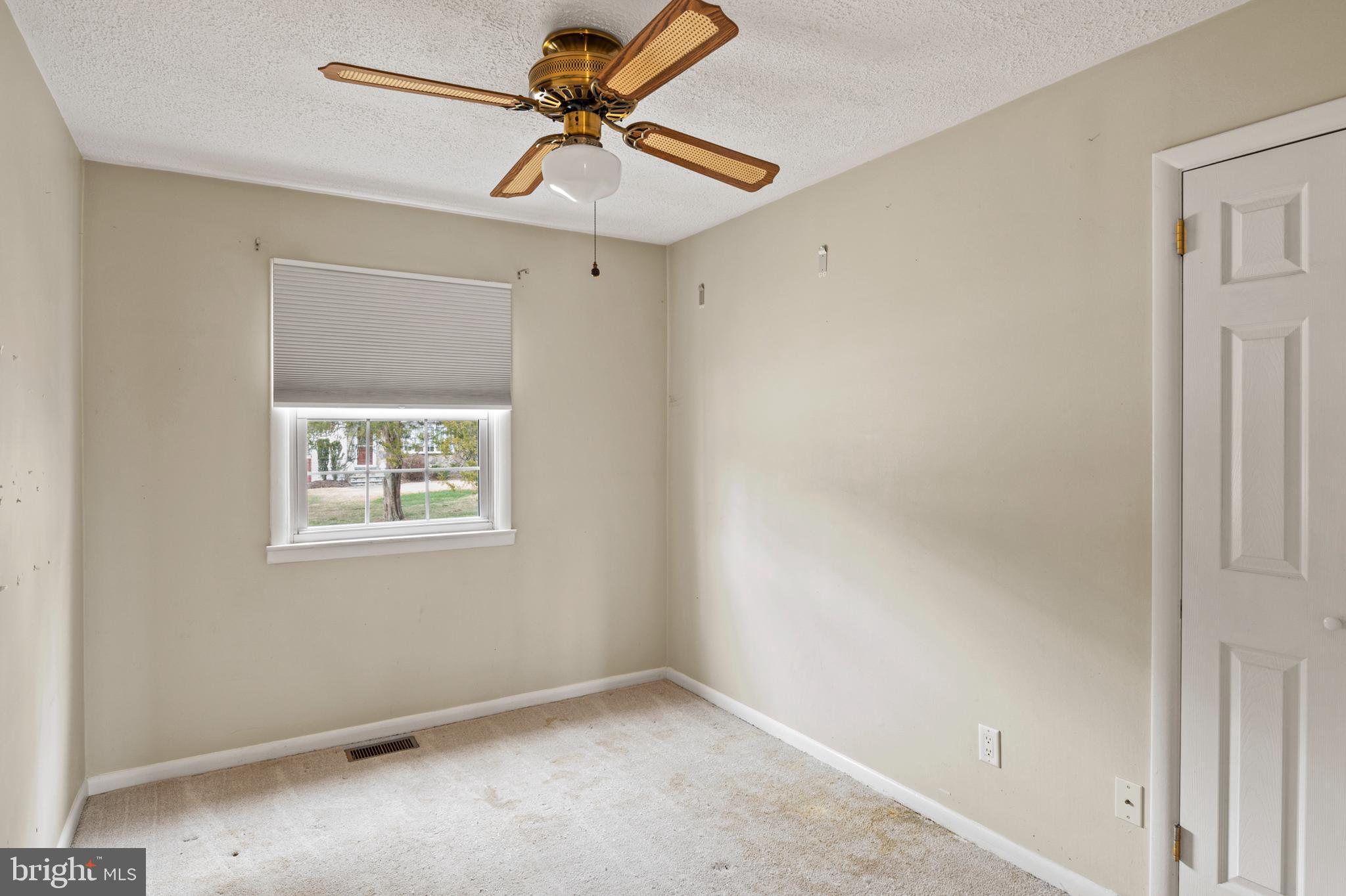 107 Holly Road Edgewater, MD 21037 - Photo 12 of 31 an empty room with a window and a fan