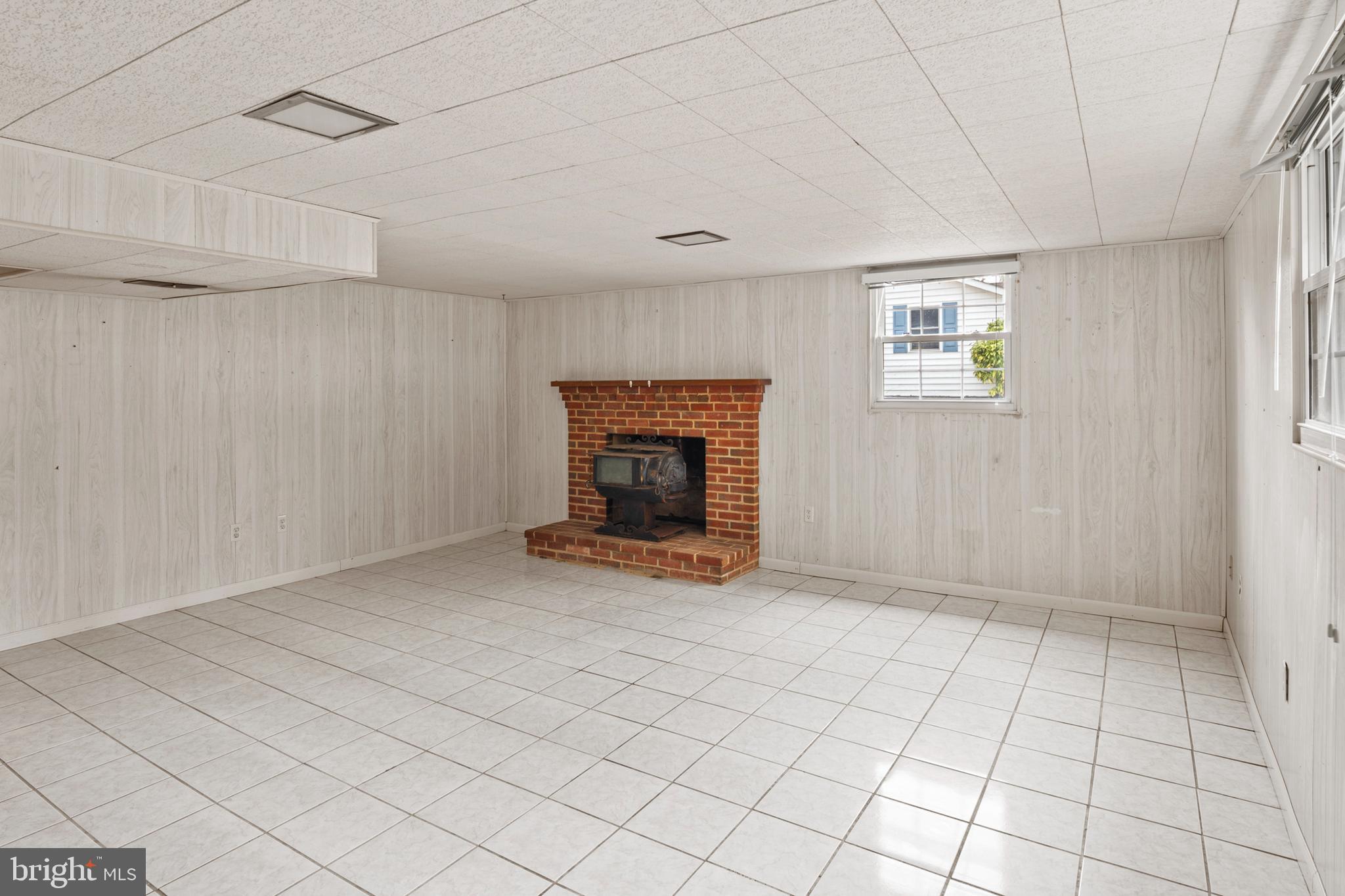 107 Holly Road Edgewater, MD 21037 - Photo 15 of 31 a view of an empty room with a fireplace