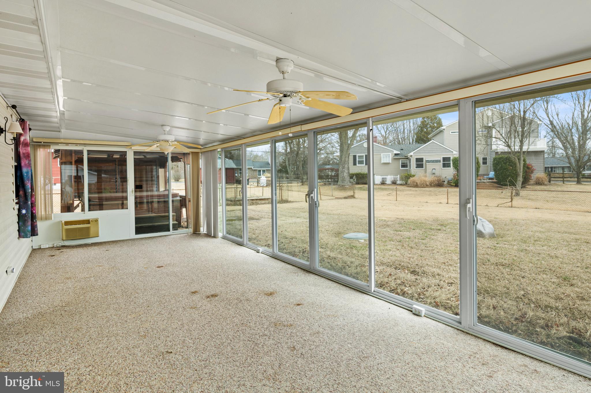 107 Holly Road Edgewater, MD 21037 - Photo 19 of 31 a view of an empty room with windows