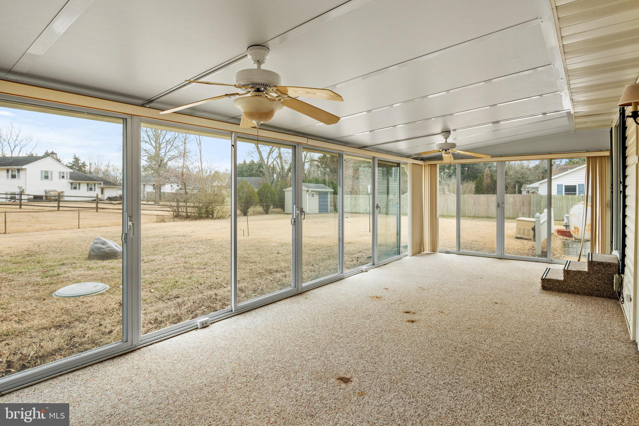 107 Holly Road Edgewater, MD 21037 - Photo 20 of 31 a view of empty room with floor to ceiling windows
