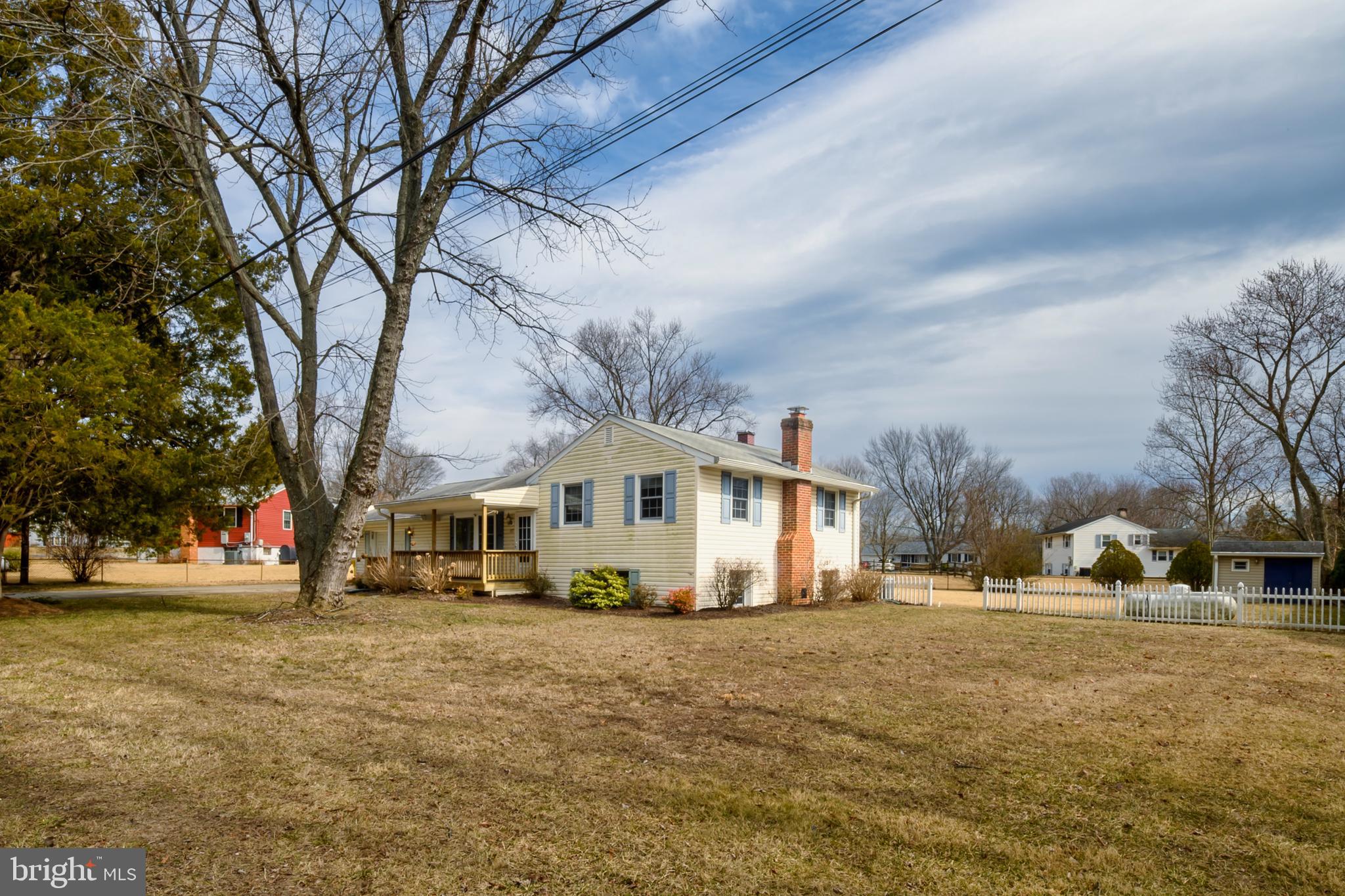 107 Holly Road Edgewater, MD 21037 - Photo 2 of 31 a front view of a house with a yard