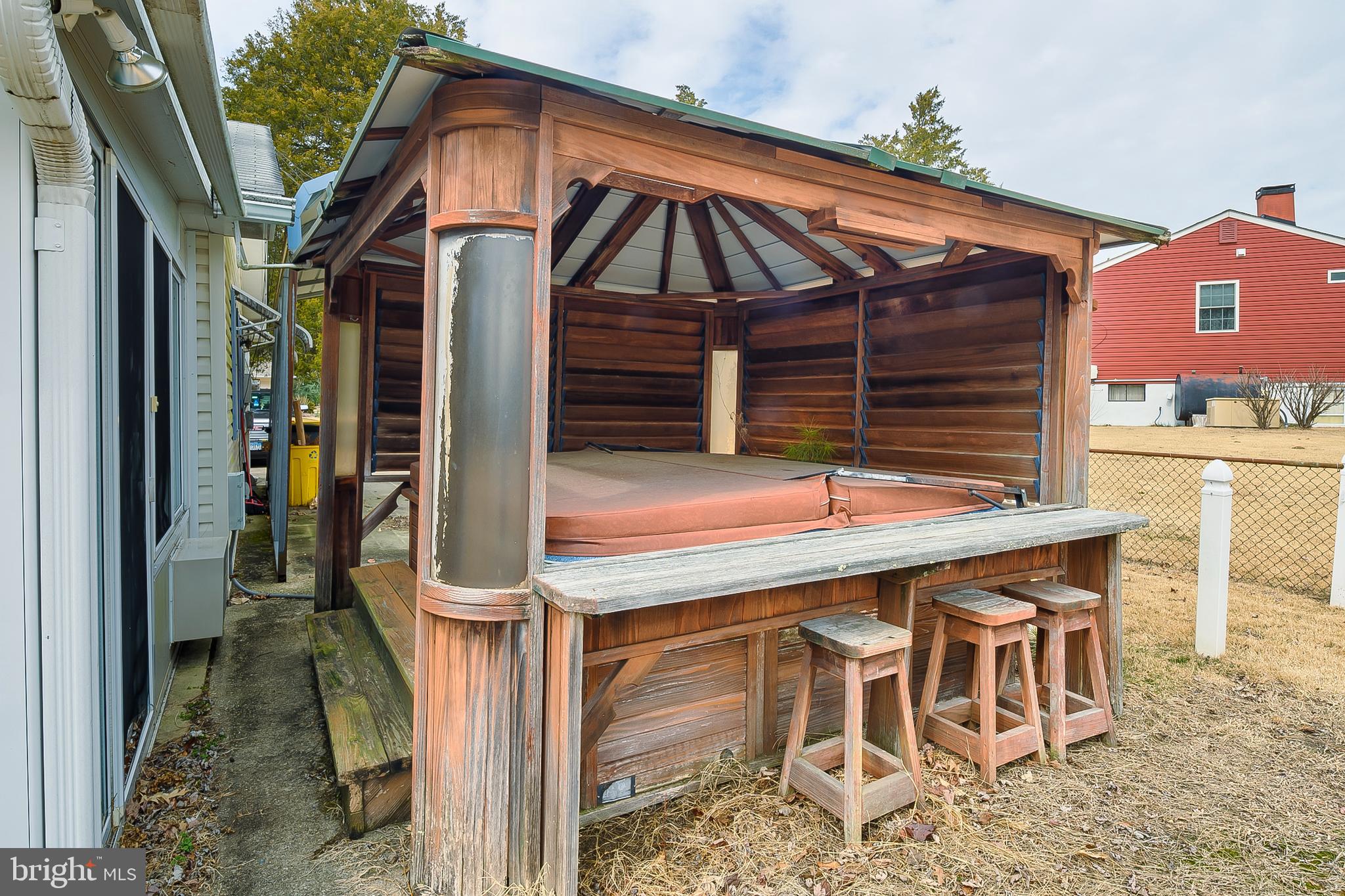 107 Holly Road Edgewater, MD 21037 - Photo 22 of 31 a view of a dinning table and chairs in the patio