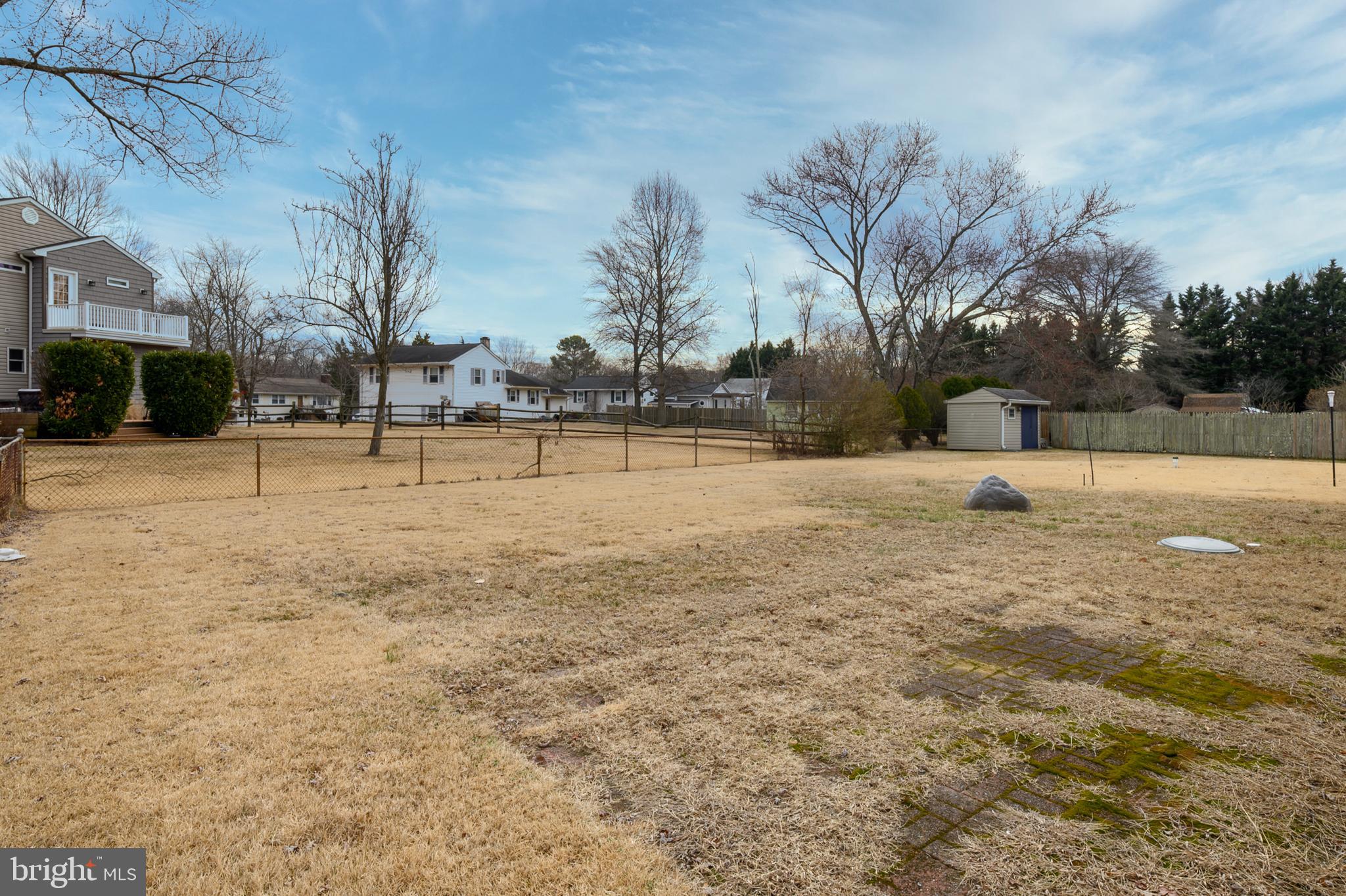 107 Holly Road Edgewater, MD 21037 - Photo 23 of 31 a street view with large trees