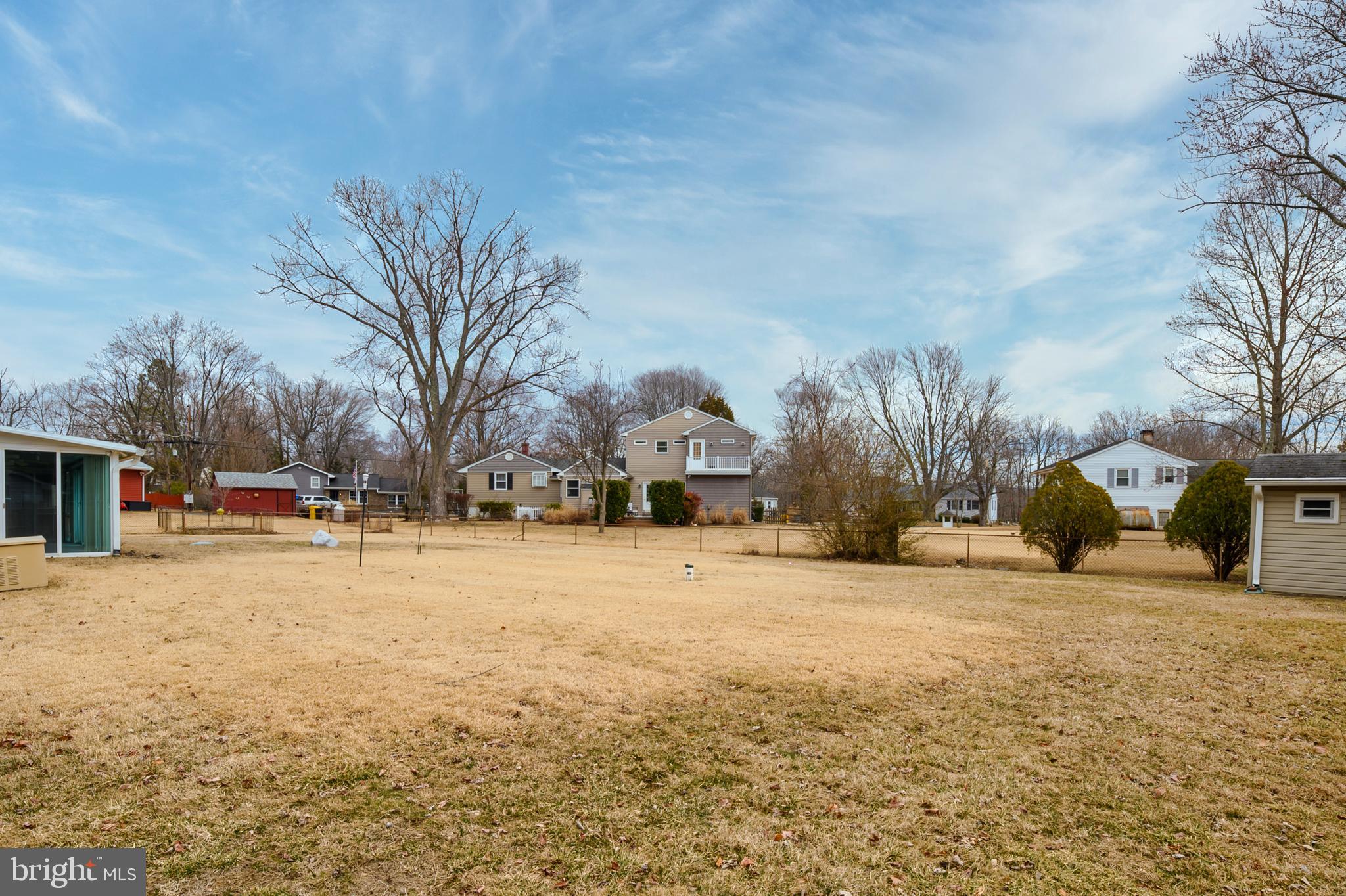107 Holly Road Edgewater, MD 21037 - Photo 24 of 31 a yellow house with trees in front of it