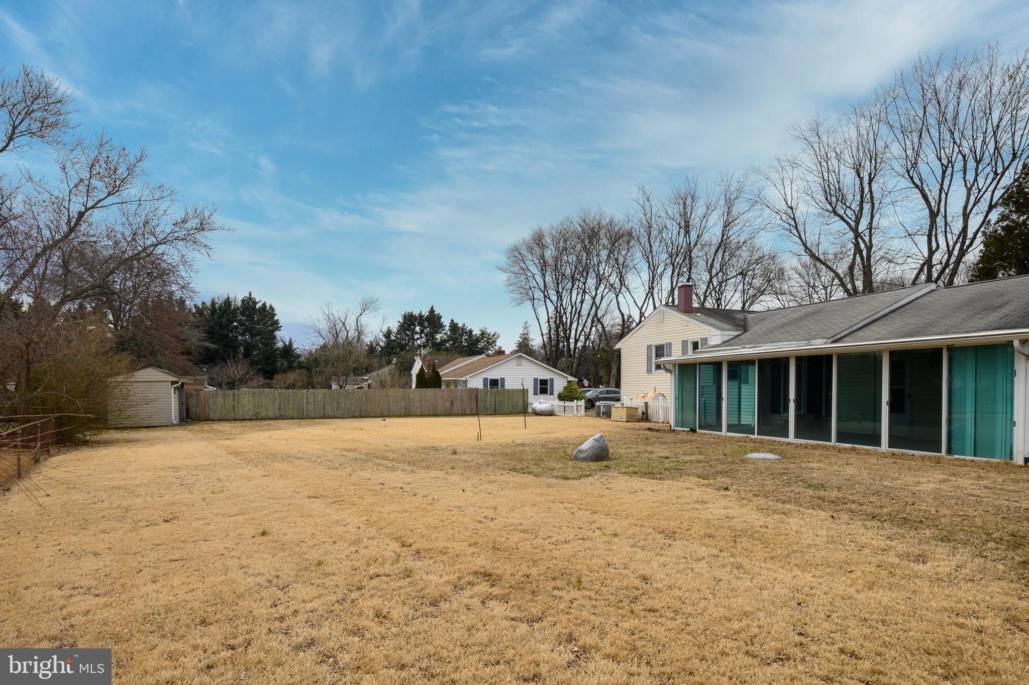 107 Holly Road Edgewater, MD 21037 - Photo 25 of 31 a front view of a house with a yard and trees