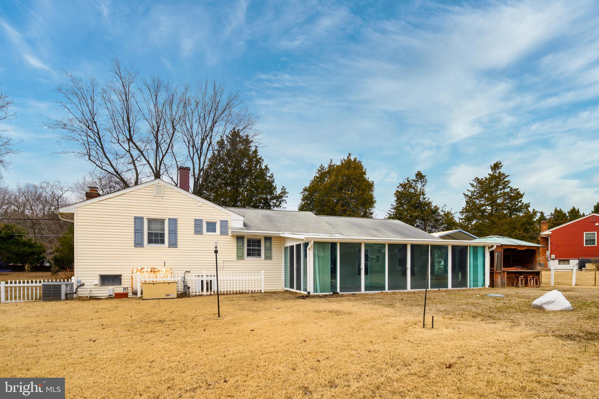 107 Holly Road Edgewater, MD 21037 - Photo 27 of 31 a front view of a house with a yard