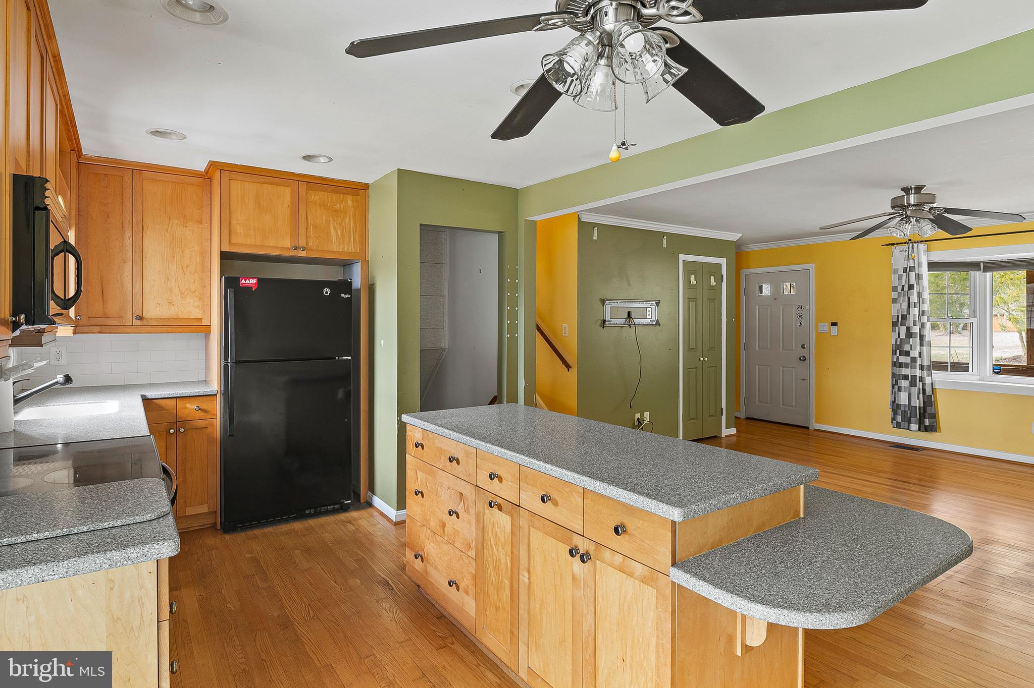 107 Holly Road Edgewater, MD 21037 - Photo 4 of 31 a kitchen with stainless steel appliances granite countertop a refrigerator and a sink