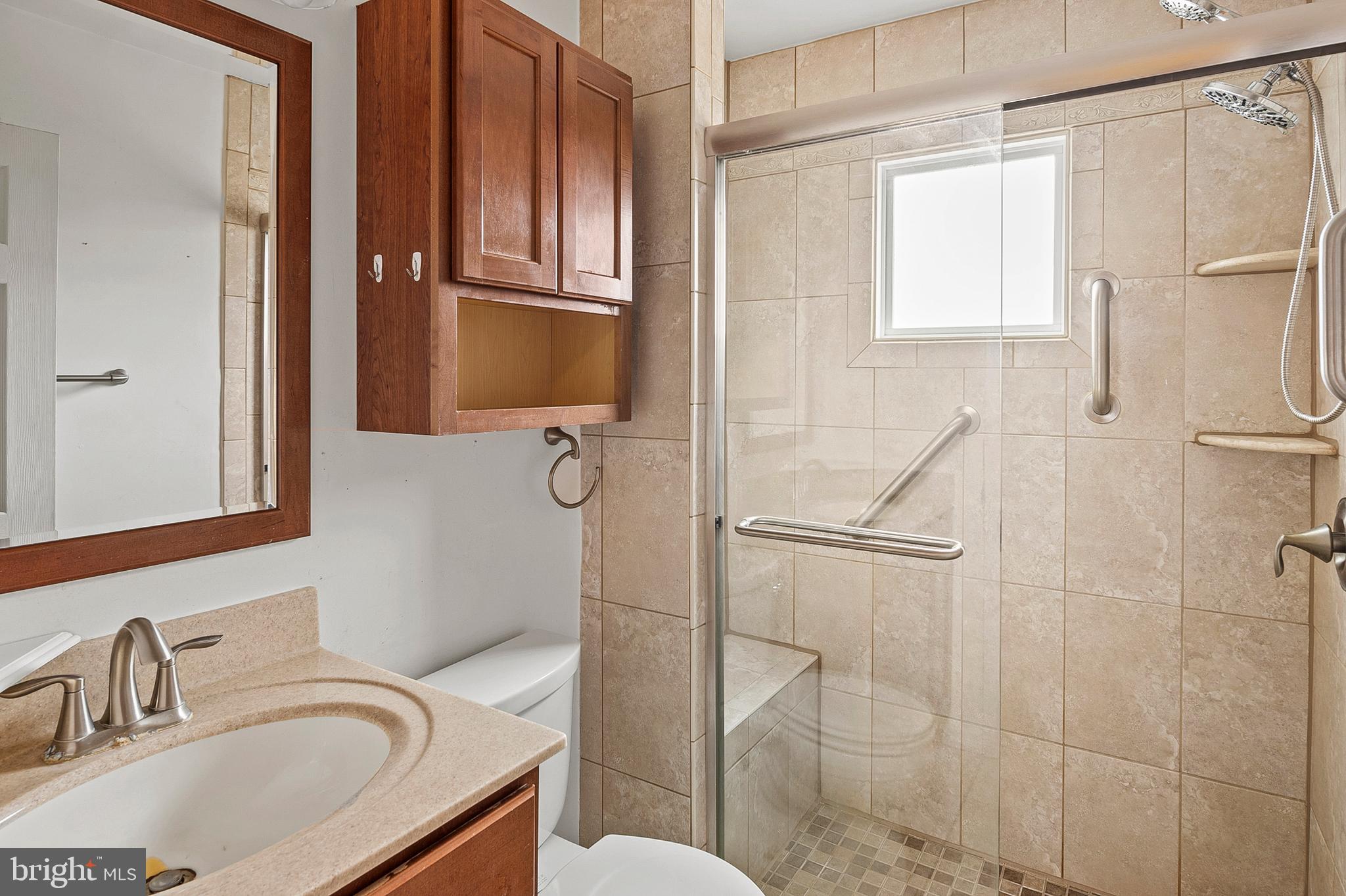 107 Holly Road Edgewater, MD 21037 - Photo 10 of 31 a bathroom with a granite countertop sink toilet and shower