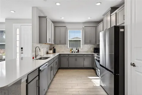 a bedroom with a bed and a chair