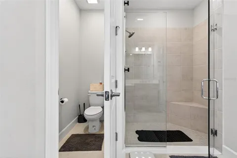 an aerial view of a house with a lake view