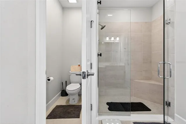 an aerial view of a house with a lake view