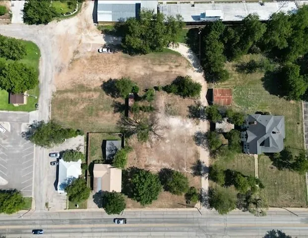 an aerial view of a house with yard