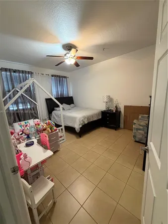 a bedroom with furniture and a chandelier