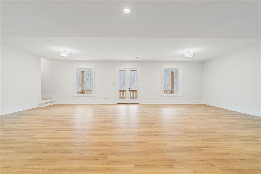 555 Lower Birmingham Road Canton, GA 30115 - Photo 85 of 104 a view of empty room with wooden floor and fan