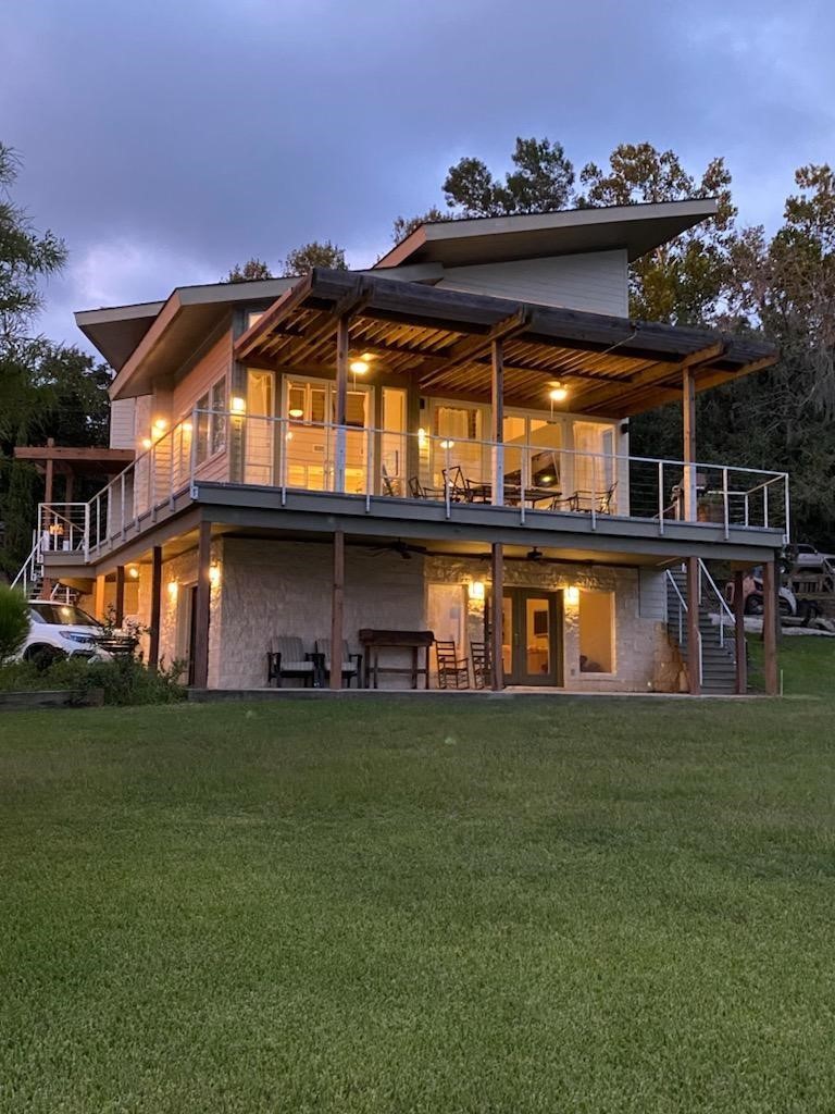68 Edgewater Way Point Blank, TX 77364 - Photo 2 of 49 PROPERTY IN THE EVENING WITH BEAUTIFUL LIGHTING