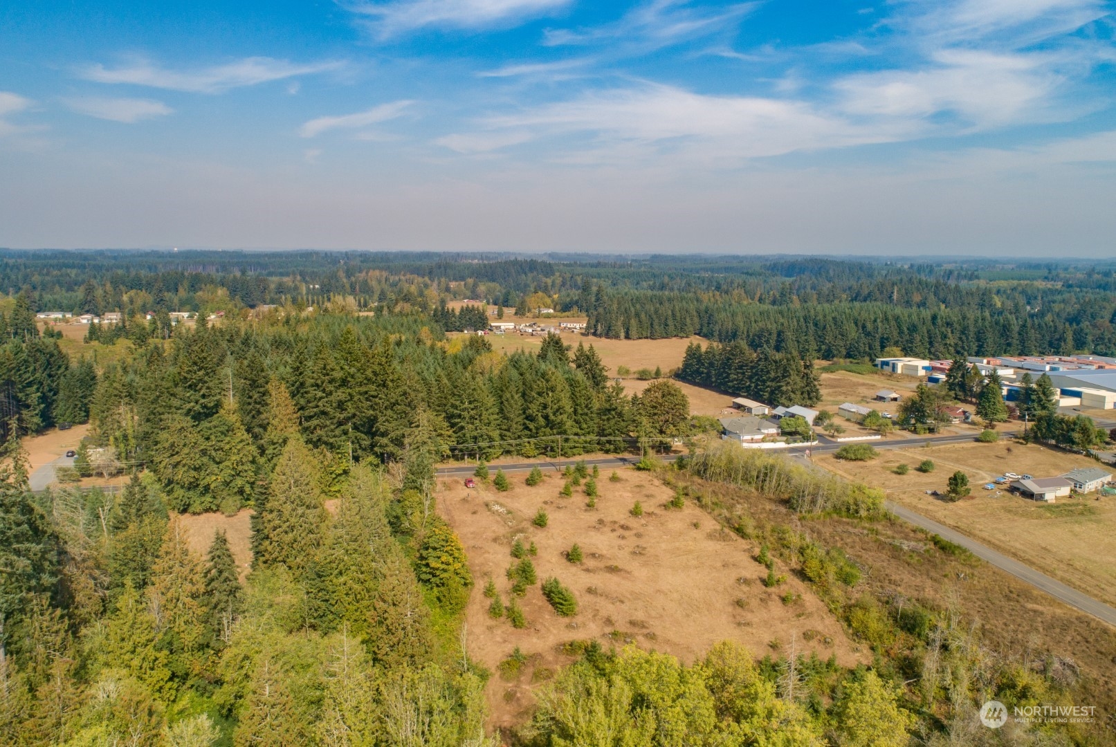 690 Nevil Road Winlock, WA 98596 - Photo 3 of 11 a view of a lake with houses in the back
