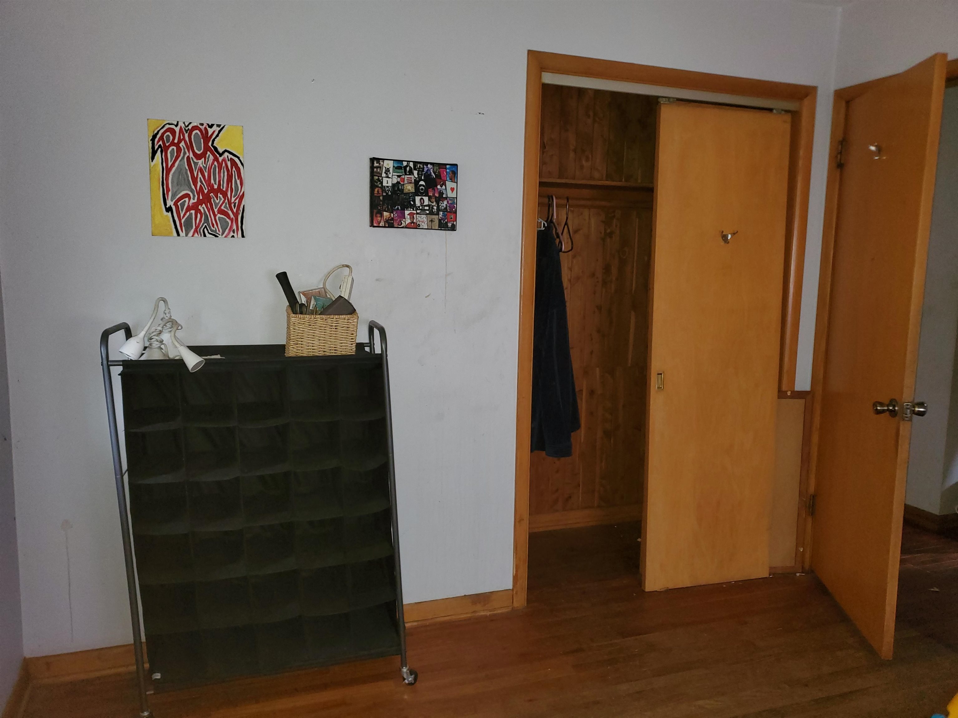 2511 Ashland Avenue Rockford, IL 61101 - Photo 11 of 15 a view of a hallway with wooden floor and closet