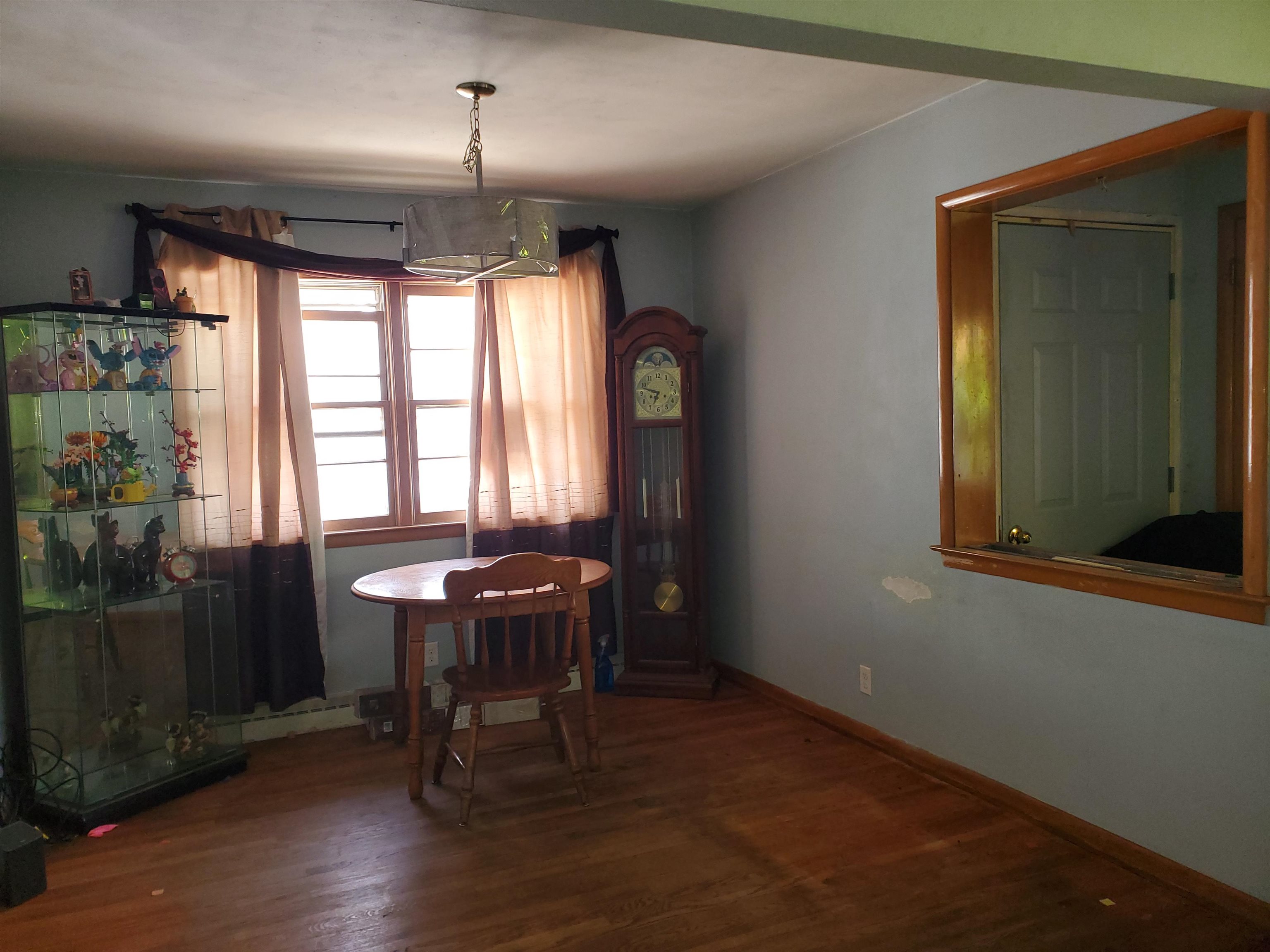 2511 Ashland Avenue Rockford, IL 61101 - Photo 4 of 15 a dining room with furniture and window