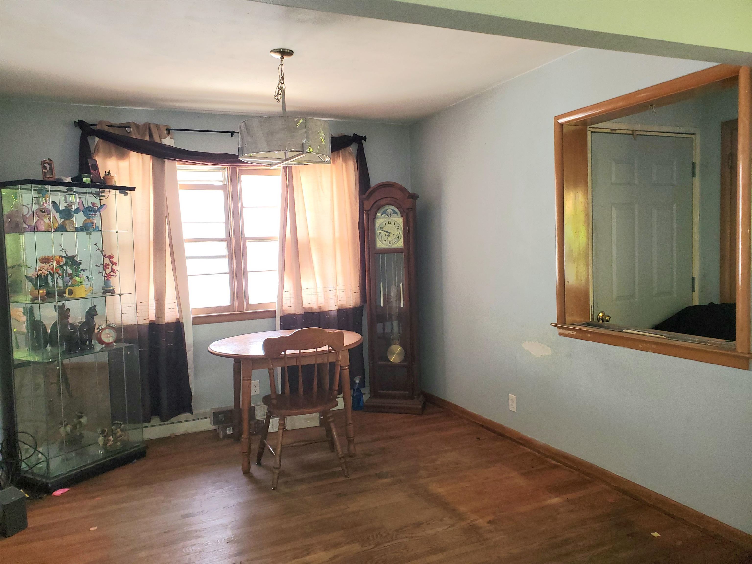 2511 Ashland Avenue Rockford, IL 61101 - Photo 5 of 15 a dining room with furniture and window