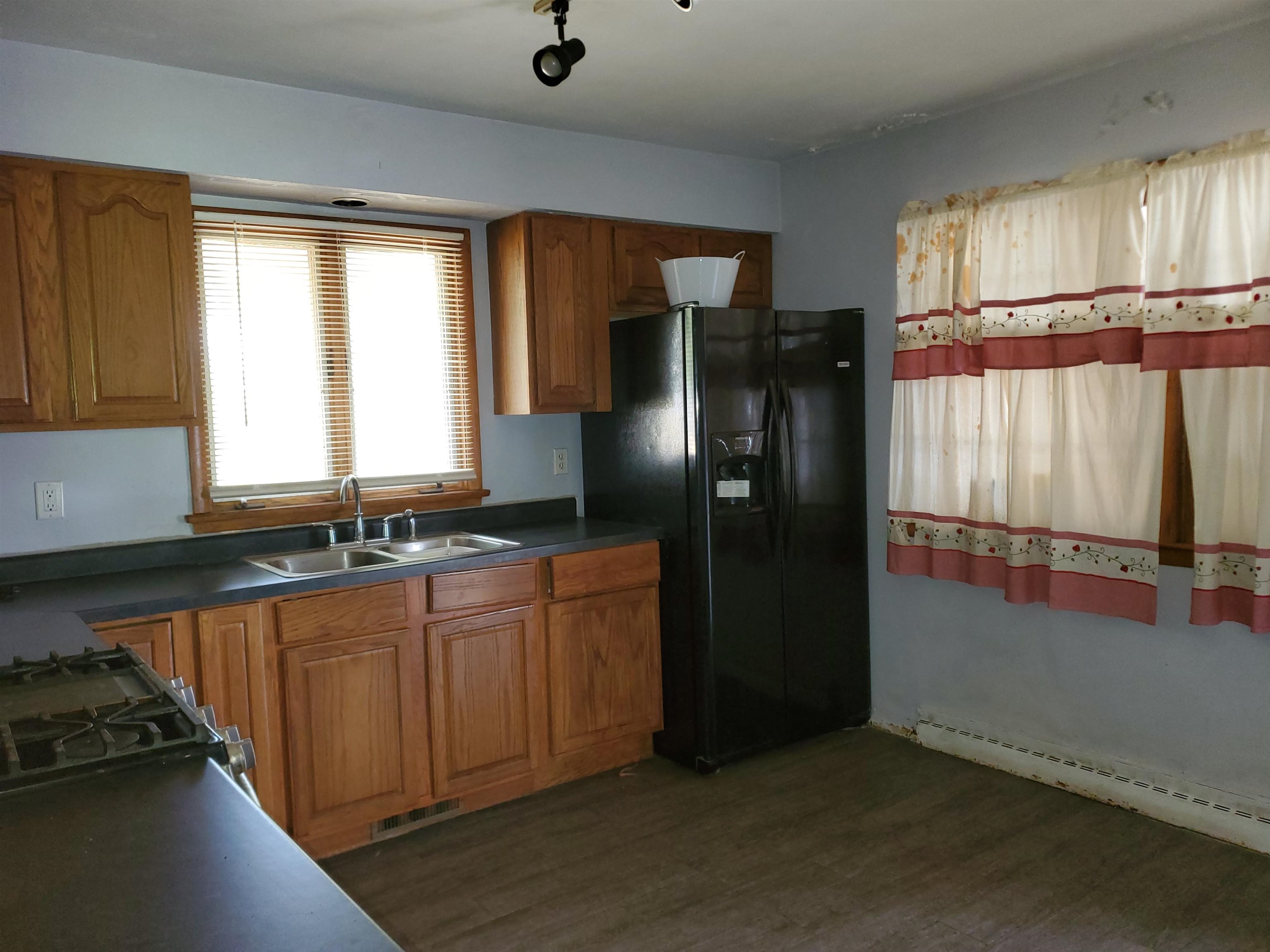 2511 Ashland Avenue Rockford, IL 61101 - Photo 7 of 15 a kitchen with stainless steel appliances granite countertop a refrigerator and a sink